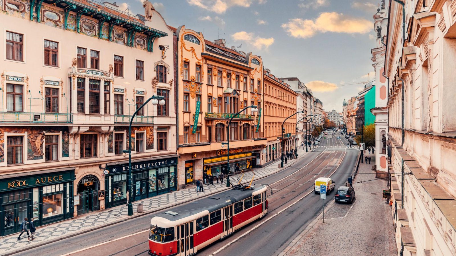 Classic red Prague tram on a historic city street