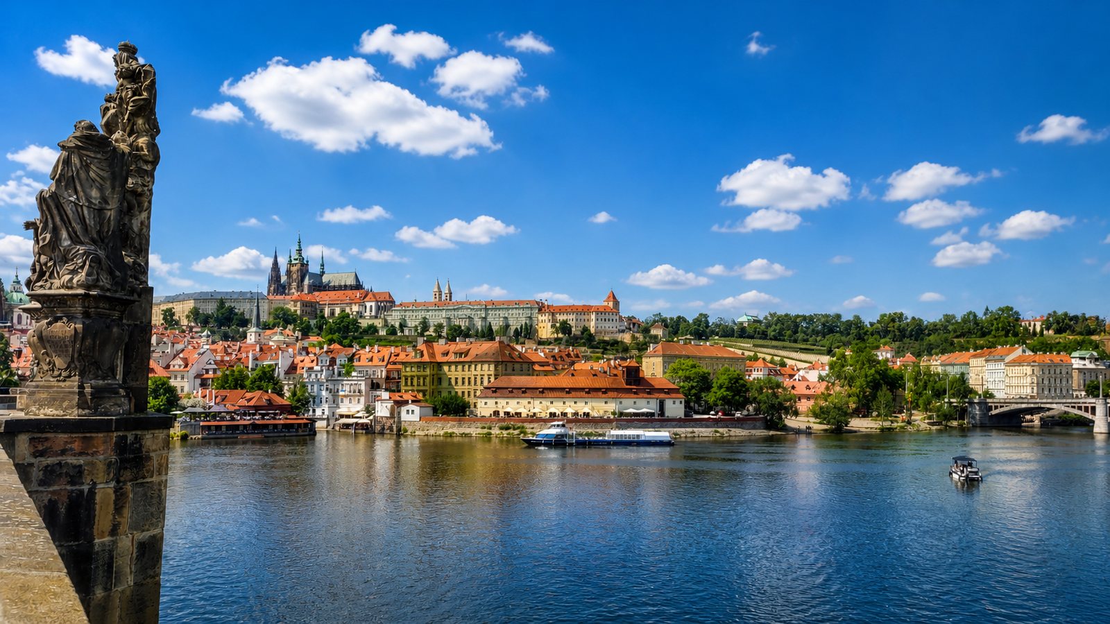 Prague Castle and the Vltava river from Charles Bridge in summer