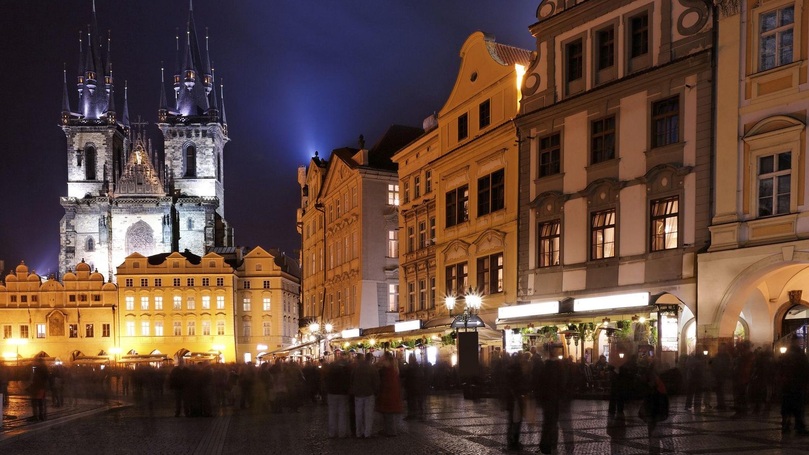 Old Town Square in Prague at evening with people gathered