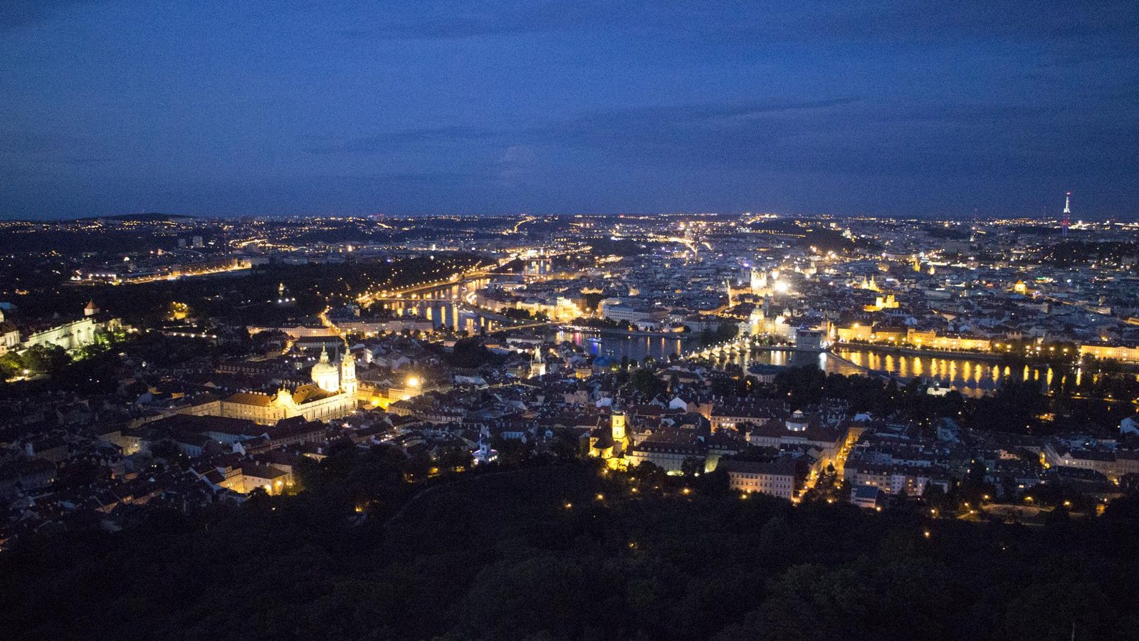 Prague city skyline lit up at night
